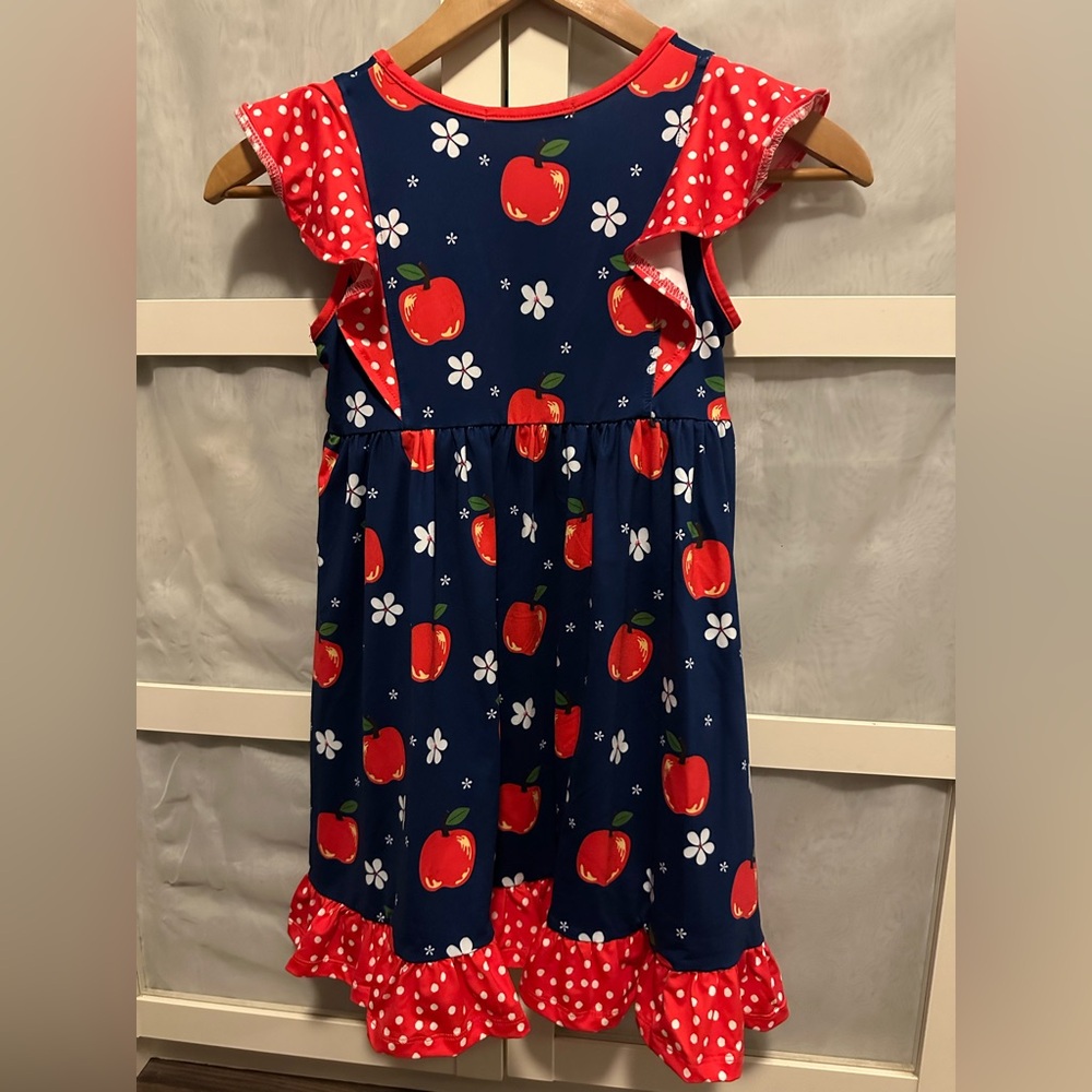 Navy Blue dress with red apples and white polka dots and flowers.